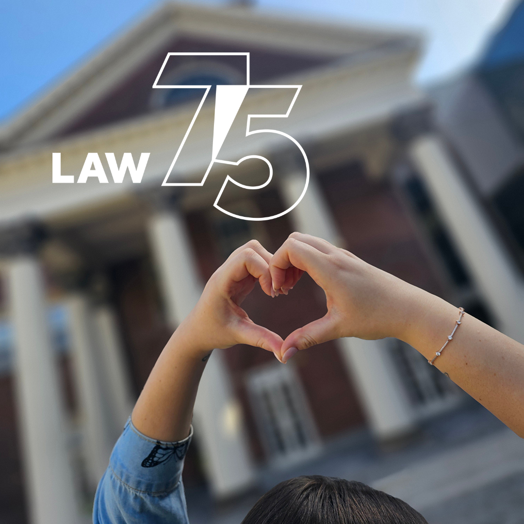 Hands in the shape of a heart in front of Flavelle House in the background